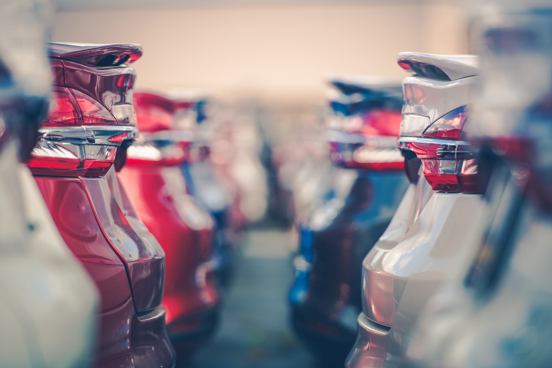Cars For Sale. Automotive Industry. Cars Dealership Parking Lot. Rows of Brand New Vehicles Awaiting New Owners.
